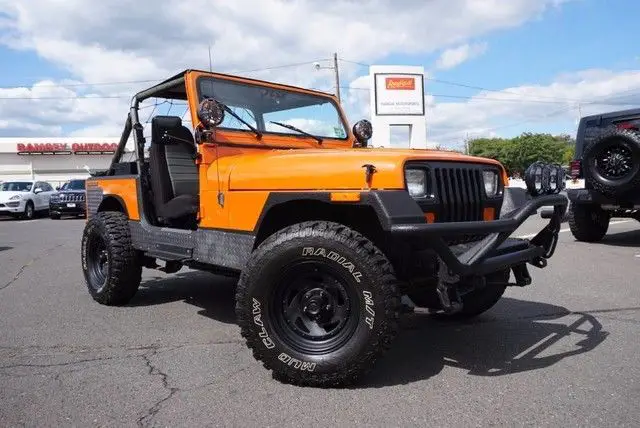 1988 jeep wrangler sahara, mud claw tires, orange, hard top, full doors