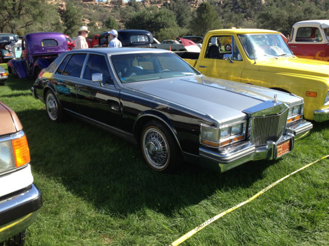 this black and silver paint is off 2004 cads with the small flakes grate cond