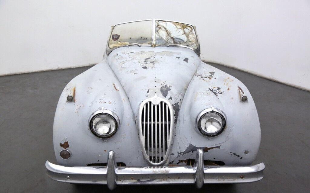 1956 jaguar xk roadster grey primer with a black interior