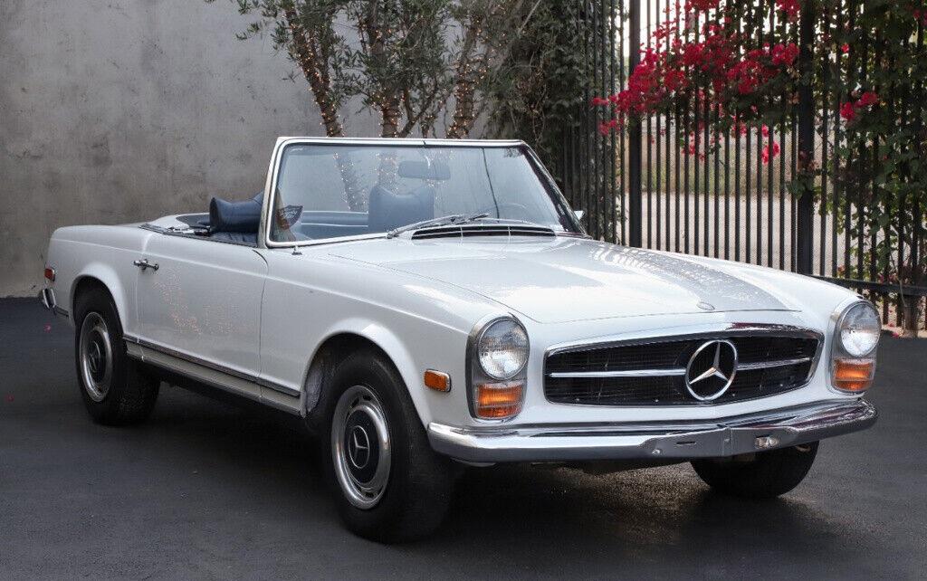 1969 mercedes benz 200 series 280sl papyrus white with a blue interior