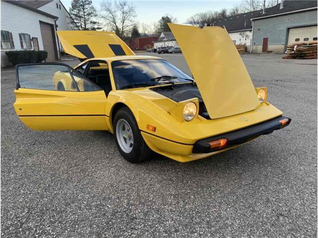 1977 ferrari 308 gtb restored fly yellow with a black interior