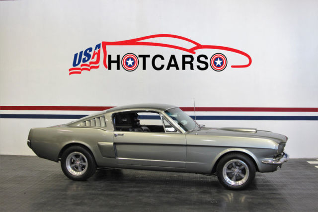 1965 ford mustang fastback looks just as fast sitting still as it does driving!
