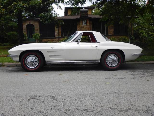 #s matching 327 300 hp 4speed 308 posi 2 tops leather