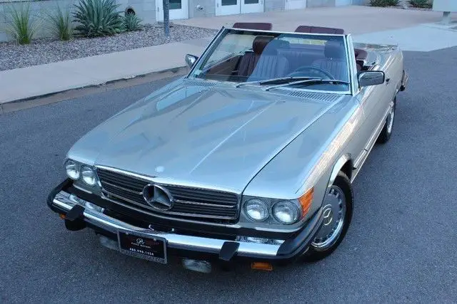 1987 mercedes-benz sl 560. smoke silver/red. rare back seat. very clean