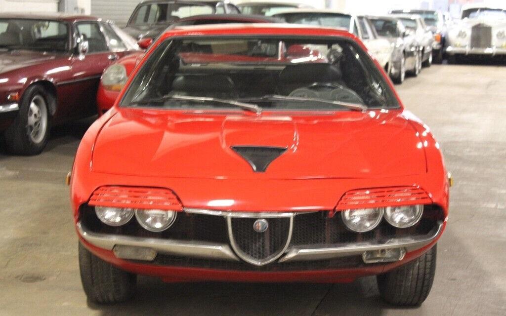 1973 alfa romeo montreal coupe red with a black interior