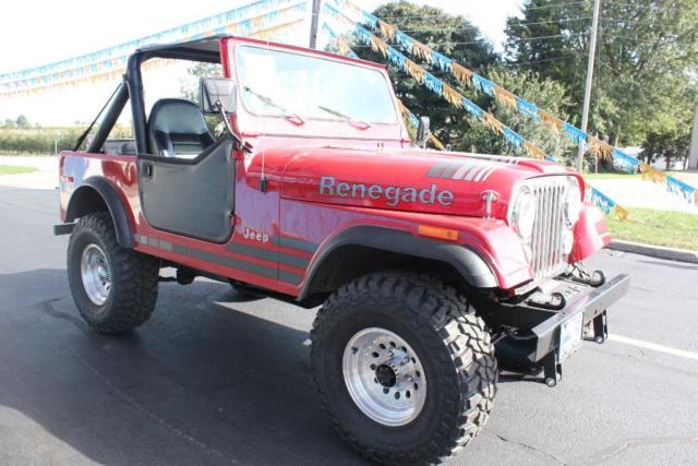 4x4 cj-7 lifted soft top 33 inch mud tires red